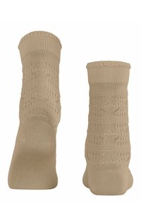 Beige gestrickte Socken mit einem Spitzenmuster, gerippten Bündchen und einer glatten Textur. Sie haben verstärkte Fersen für Langlebigkeit und Fußunterstützung.