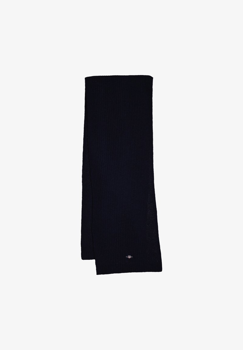 Sciarpa a maglia di un blu navy scuro, forma rettangolare con texture a coste. Presenta un piccolo logo decorativo su un'estremità. Tessuto morbido e misto.