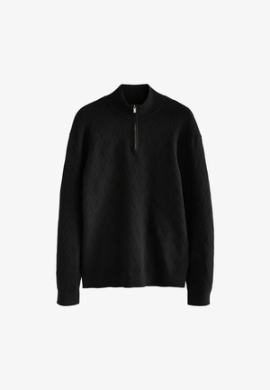 Black sweater with a high collar and zip closure, featuring a textured diamond pattern, long sleeves, and a relaxed fit.