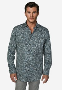 Overhemd met knopen in donkerblauw met een wit en lichtblauw bloemenpatroon, lange mouwen en een puntige kraag, gemaakt van lichtgewicht stof.