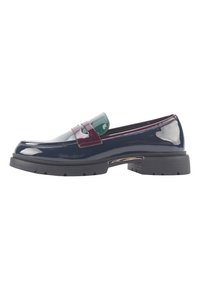 Patent leather shoe in navy, featuring a glossy green and burgundy accent strap. Chunky black rubber sole with distinct tread pattern.