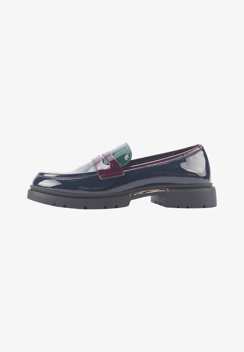 Patent leather shoe in navy, featuring a glossy green and burgundy accent strap. Chunky black rubber sole with distinct tread pattern.