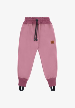 Różowe dziecięce spodnie dresowe z elastycznym paskiem w talii, czarnym sznurkiem, prążkowanymi mankietami przy kostkach oraz czarnymi paskami na stopach.