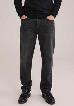 Zwarte denim jeans met een relaxed fit, voorzien van subtiele vervaging, rechte pijpvorm, vijfzakkenontwerp en een contrasterende tailleband.
