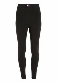 Černé legíny s přiléhavým střihem, vyrobené z elastické tkaniny. Mají vysoce kvalitní pas s logem 'TOMMY JEANS'. Hladká textura.