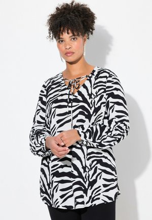 Schwarzes und weißes Zebra-Muster-Bluse mit langen Ärmeln, einem Bindeband am Hals und elastischen Bündchen, mit einem lockeren Schnitt und glatter Stoffbeschaffenheit.