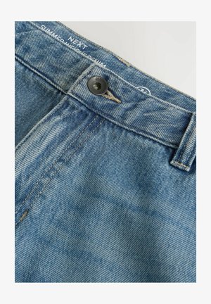 Denim shorts in light blue wash, featuring a black button closure, contrasting stitching, and branding on the waistband.