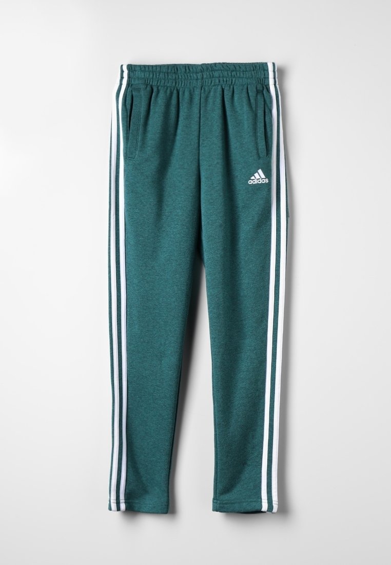 Pantaloni da jogging Adidas color teal con vita elastica, tasche laterali e triple strisce bianche che scorrono lungo ogni gamba.