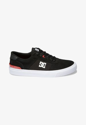 Black skate shoes with a suede upper, white rubber sole, red accents, and a white logo on the side. Round toe and lace-up design.
