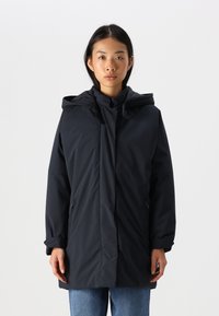 Parka navy avec capuche, dotée d'une fermeture éclair à l'avant, de poches latérales et d'une silhouette décontractée dans un tissu lisse et mat.