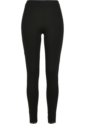 Melni legingi, kas izgatavoti no elastīga auduma, ar augstu jostu un mežģīņu apdari pie potītes, lai pievienotu detaļu. Gluda tekstūra un piegulošs dizains.