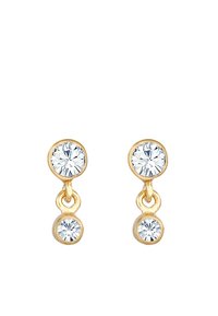 Guldtonede øreringe med to hængende runde krystaller, en større øverst og en mindre nederst. Glat metaloverflade, klare og glitrende sten.