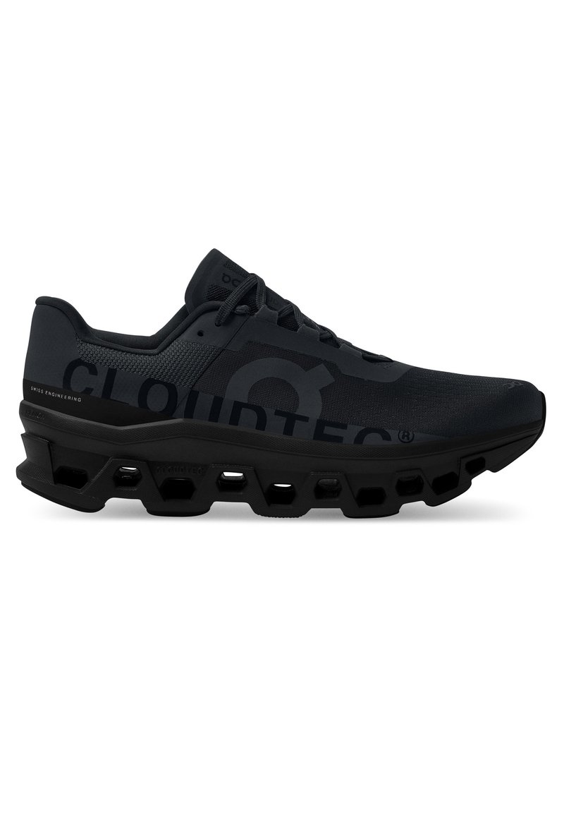 Schwarzer Sportschuh mit einer strukturierten Oberseite, ausgestattet mit einem markanten CLOUDTEC-Logo und einem hexagonalen Sohlendesign, das für verbesserte Dämpfung und Unterstützung sorgt.