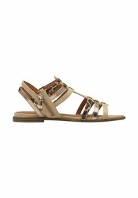 Sandalia plana beige con múltiples tiras, un acento metálico y un detalle de estampado de leopardo en la parte superior. Cremallera lateral para facilitar su uso.