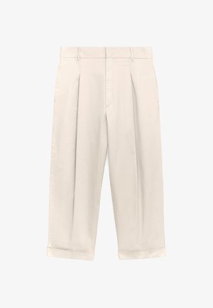Jasno beżowe spodnie o luźnym kroju, z fałdami z przodu, z suwakiem i podwiniętymi mankietami. Wykonane z gładkiego, lekkiego materiału.