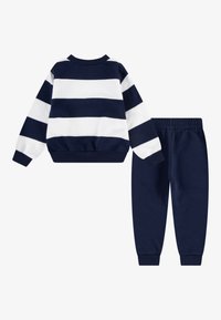 Nike Sportswear CLUB STRIPE CREW UNISEX SET - Spodnji deli trenirk - midnight navy