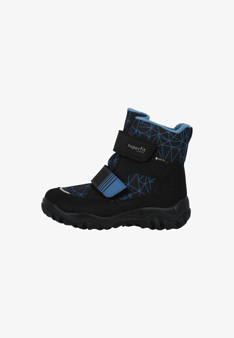 Botas de invierno negras con un patrón geométrico azul, correas de velcro y una suela texturizada. Material Gore-Tex para protección impermeable.