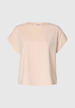 Béžové tričko s krátkym rukávom a voľným strihom s okrúhlym výstrihom, vyrobené z mäkkej látky, zobrazené na jednofarebnom svetlošedom pozadí.