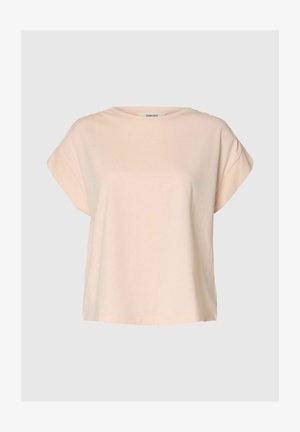 Béžové tričko s krátkym rukávom a voľným strihom s okrúhlym výstrihom, vyrobené z mäkkej látky, zobrazené na jednofarebnom svetlošedom pozadí.