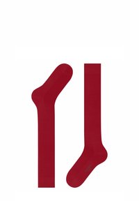 Czerwone skarpetki o gładkiej fakturze, z jednolitym wzorem. Zawierają delikatny wzór w okolicy kostki oraz gładki ściągacz.