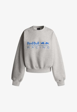 Grauer Sweatshirt aus Baumwollmischung; verfügt über einen gerippten Saum und Bündchen. Auf der Vorderseite prangt "Red Bull Racing" in blauer Schrift mit Logo.