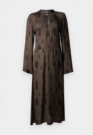Long brown dress featuring a subtle black animal print, long sleeves, a keyhole neckline, and a flowing silhouette.
