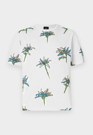 T-shirt branca de manga curta com um padrão floral repetido em azul, amarelo e verde, com contornos em preto, feita de tecido leve.