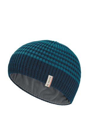 Gestrickte blaue und türkisfarbene Mütze mit strukturiertem Muster und grauem Fleecefutter, mit einem kleinen weißen Etikett mit Valde-Logo.