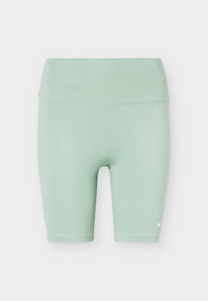 Shorts de cycliste extensibles taille haute vert clair avec un petit logo Nike blanc sur la partie inférieure gauche de la jambe.