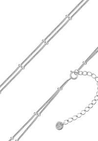 Sidabrinė grandinėlė apyrankė su daugybe tarpusavyje susijusių sruogų, kurios turi sferinių akcentų ir saugų užsegimą su reguliuojamu ilgiu.