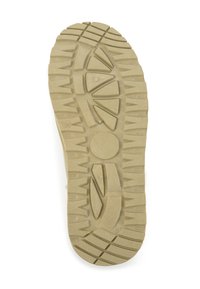 Rubberen zool met diepe groeven en een gestructureerd oppervlak. Lichtbeige kleur met een cirkelpatroon en hoekige profiel voor grip. Maat 36 aangegeven.