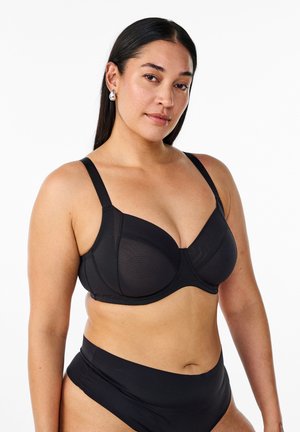 Black underwire bra with molded cups, adjustable straps, smooth texture, and minimal hardware. Paired with high-waisted black bikini bottoms.