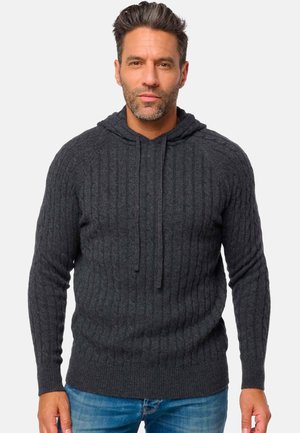 Hoodie gris en tricot avec une texture côtelée, un cordon de serrage, des manches longues et une coupe décontractée. Le matériau semble doux et chaud.