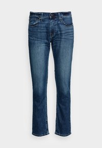 Mörkblå denimjeans med rak bendesign, med bältesöglor, knappstängning och framfickor. Slät textur med lätt urblekta detaljer.