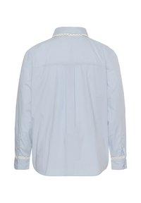 Light blue long-sleeve shirt shown from the back with lace trim on collar and cuffs, featuring buttoned cuffs and a center pleat.