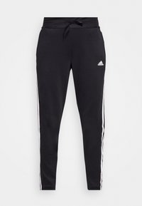 Schwarze Sporthosen aus weichem Stoff, mit einem Kordelzugbund und weißen seitlichen Streifen. Das Adidas-Logo ist auf der linken Hüfte angebracht.