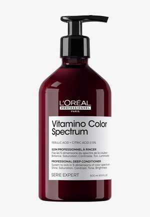 Mørkerød L'Oréal Professionnel Vitamino Color Spectrum dybdebehandlingsflaske med sort pumpe og hvid etiket.
