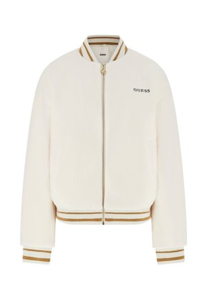 Veste bomber couleur crème en tissu doux et texturé. Dotée d'une fermeture éclair dorée, de poignets côtelés et d'un col et d'un ourlet rayés. Logo "GUESS" sur le devant.