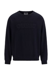 Svart crewneck-tröja med långa ärmar, ribbad mudd och upphöjd "GUESS"-logotyp på bröstet.