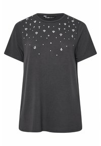 Grå kortärmad t-shirt, rund hals, med spridda vita blommor som dekoration, mjukt tyg, avslappnad passform och rak nederkant.