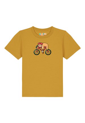 T-shirt en coton jaune avec un graphique d'un personnage de dessin animé faisant du vélo, avec des contours noirs et des accents colorés.