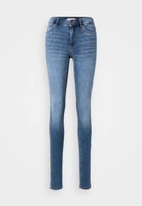 Feszes farmernadrág fakó középkék denim anyagból. Gombbal és cipzárral záródik, öt zsebe van, és varrási díszítések találhatók az illesztéseknél.