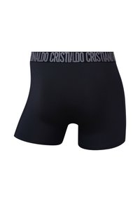 Sorte boxershorts lavet af glat stof med en sort elastisk linning med hvid "Cristiano"-branding. Set bagfra.