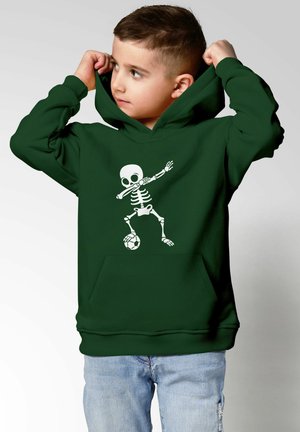 Grüne Kapuzenjacke aus Baumwollmischung mit einem weißen Skelettgrafik, das Fußball spielt. Mit einer Fronttasche und gerippten Bündchen.