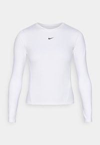 Duga rukava bijela atletska majica od lagane, prozračne tkanine s uskim krojem. Ima mali crni Nike logo na prsima.