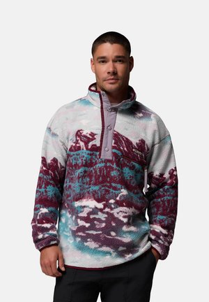 Fleece pullover with a multicolored mountain pattern in purple, teal, and white. Features a half-zip collar and a chest pocket.