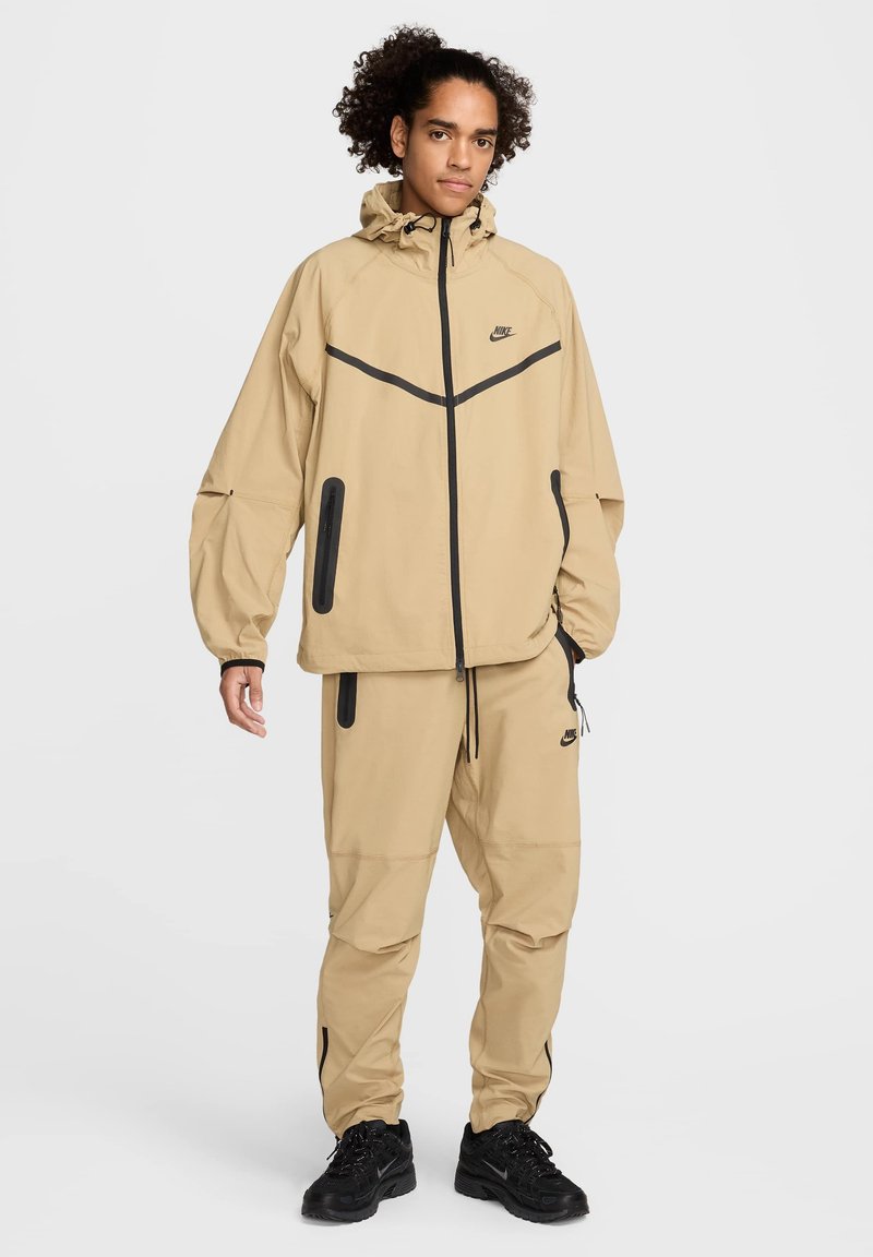 Nike Sportswear Lichte jas beige Nike Sportswear Lichte jas beige