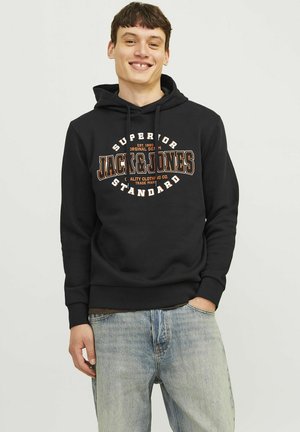 Black hooded sweatshirt with "Jack & Jones" logo in white and orange. Made of soft fabric, featuring a kangaroo pocket and ribbed hem.