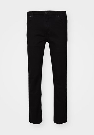 Black jeans with a slim fit, made from cotton. Features five pockets, a metal button closure, and a smooth texture.