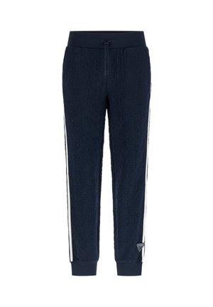 Navyblauwe joggers met een reliëf herhalend logo-patroon, witte zijstrepen, een trekkoord in de taille, afgeknipte enkels en een kleine driehoekige merkpatch nabij de zoom.